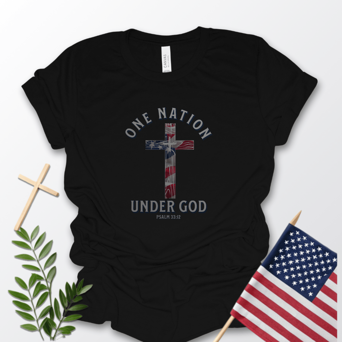 One Nation Under God Christian patriotic T-shirt with American flag cross and Psalm 33:12 printed on a navy Bella Canvas 3001 shirt