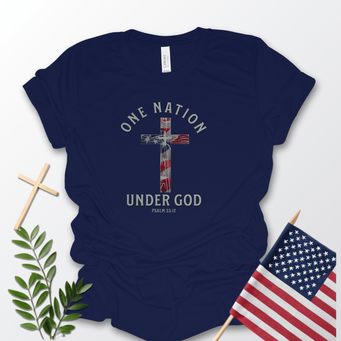 One Nation Under God Christian patriotic Navy Blue Bella Canvas 3001 T-shirt with American flag cross and Bible verse Psalm 33:12